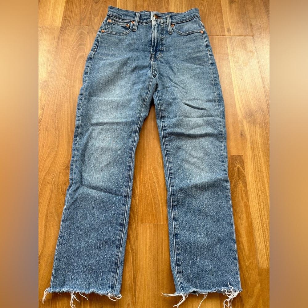Madewell, size 23, light wash skinny jeans with stressed bottoms